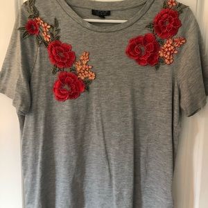 Soft grey tee shirt with red embroidered flowers